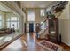 Grand foyer with hardwood floors, wine storage, staircase, and two-story ceilings, creating a welcoming and impressive entrance at 7408 Sodalite Way, Castle Rock, CO 80108