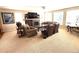 Cozy living room features a fireplace, large windows, and comfortable seating arrangement at 7408 Sodalite Way, Castle Rock, CO 80108