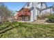 Spacious backyard with lush green grass and tiered deck space at 3823 S Uravan St, Aurora, CO 80013