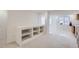 Finished basement area features built-in shelving and adjacent kitchenette space at 3823 S Uravan St, Aurora, CO 80013