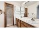 Bathroom with double sinks, vanity and separate tub/shower room at 3823 S Uravan St, Aurora, CO 80013