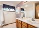 Comfortable bathroom with a double sink vanity, offering convenience and style at 3823 S Uravan St, Aurora, CO 80013