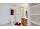 Bathroom featuring a glass-enclosed shower, vanity, and adjacent shelving unit at 3823 S Uravan St, Aurora, CO 80013