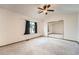 Spacious bedroom with mirrored closet doors and ample natural light at 3823 S Uravan St, Aurora, CO 80013
