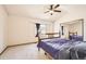 Vaulted bedroom with a bright bay window and mirrored closet doors at 3823 S Uravan St, Aurora, CO 80013