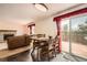 Dining area with a view of the living room and a sliding glass door at 3823 S Uravan St, Aurora, CO 80013