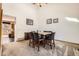 Dining room area featuring carpet, a dining table, and bright walls at 3823 S Uravan St, Aurora, CO 80013
