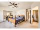 Spacious main bedroom with neutral walls, vaulted ceiling, and a double mirrored closet at 3823 S Uravan St, Aurora, CO 80013