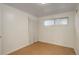 Simple bedroom with a light and airy feel, neutral walls, and one window at 4521 E Jewell Ave, Denver, CO 80222