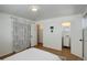 Inviting bedroom with ensuite bathroom and closet with white and grey decor at 4521 E Jewell Ave, Denver, CO 80222