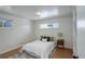 Cozy bedroom with a comfortable bed, natural light, and neutral décor at 4521 E Jewell Ave, Denver, CO 80222