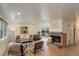 Bright living room with large windows, cork floors, fireplace, and stylish furnishings at 4521 E Jewell Ave, Denver, CO 80222