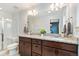 Beautiful bathroom featuring double sinks, granite counters, and a glass shower at 7808 W 43Rd Pl, Wheat Ridge, CO 80033