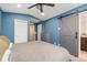 The primary bedroom features an ensuite bathroom and barn-style sliding door at 7808 W 43Rd Pl, Wheat Ridge, CO 80033