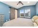 Comfortable bedroom with a sliding barn door at 7808 W 43Rd Pl, Wheat Ridge, CO 80033