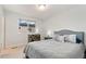 Cozy bedroom with neutral tones, a large window, and modern furnishings at 7808 W 43Rd Pl, Wheat Ridge, CO 80033