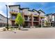 Modern townhome exteriors with brick accents, balconies, and well-maintained landscaping at 7808 W 43Rd Pl, Wheat Ridge, CO 80033