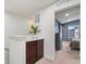 Hallway leading to a bedroom with barn door, built-in cabinets and carpeted floors at 7808 W 43Rd Pl, Wheat Ridge, CO 80033