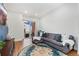 Spacious living room with gray sectional couch and access to balcony at 7808 W 43Rd Pl, Wheat Ridge, CO 80033