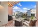 Relax on the covered patio with a gas grill, seating, and views of the neighborhood at 7808 W 43Rd Pl, Wheat Ridge, CO 80033