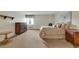 A bedroom with neutral carpet, a queen-sized bed, a wooden dresser and nightstand at 13961 E Marina Dr # 314, Aurora, CO 80014