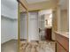 View into a walk-in closet with custom shelving with view into the ensuite at 13961 E Marina Dr # 314, Aurora, CO 80014
