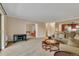 Spacious living room with neutral carpet, comfortable sofa, and view into the kitchen at 13961 E Marina Dr # 314, Aurora, CO 80014