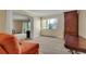 Bright living room with neutral carpet, large window and sliding door to balcony at 13961 E Marina Dr # 314, Aurora, CO 80014