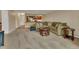 Spacious living room with neutral carpet, a comfortable sofa, and view into the kitchen at 13961 E Marina Dr # 314, Aurora, CO 80014