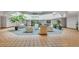 Building lobby with seating areas and lots of natural light from above at 13961 E Marina Dr # 314, Aurora, CO 80014