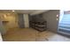 Basement area with utility sink, storage shelving, and stairs to the upper level at 4635 Teller St, Wheat Ridge, CO 80033
