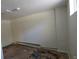 Unfinished basement with white walls, textured ceiling, and concrete flooring ready to be transformed at 4635 Teller St, Wheat Ridge, CO 80033