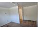 Bedroom with poor flooring and walls with no decoration at 4635 Teller St, Wheat Ridge, CO 80033