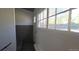 Entryway with paneled walls, large window, and exterior door at 4635 Teller St, Wheat Ridge, CO 80033