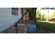 Quaint front porch with rustic railing and steps, inviting you to relax and enjoy the outdoors at 4635 Teller St, Wheat Ridge, CO 80033