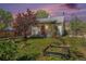 Charming home with manicured front yard, landscaping, and a cozy porch at 4635 Teller St, Wheat Ridge, CO 80033