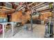 Spacious interior of garage or workshop with wooden walls and bright overhead lighting at 4635 Teller St, Wheat Ridge, CO 80033