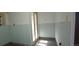 Bright hallway features paneled walls, neutral tones, and natural light streaming through glass doors at 4635 Teller St, Wheat Ridge, CO 80033