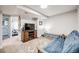 Basement area featuring a TV, mounted speakers, and carpet at 11727 Oswego St, Commerce City, CO 80640