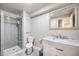 This bathroom features a glass door shower, updated vanity, and sleek design at 11727 Oswego St, Commerce City, CO 80640