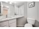 Neutral toned bathroom features granite counters, tile backsplash, and updated fixtures at 11727 Oswego St, Commerce City, CO 80640