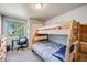 Charming bedroom with a playful bunk bed and desk area, perfect for a room at 11727 Oswego St, Commerce City, CO 80640