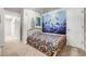 Bedroom features a colorful accent wall and carpeted floors at 11727 Oswego St, Commerce City, CO 80640