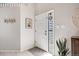 Bright entryway with neutral walls, tile flooring, and decorative wall accents that welcome visitors at 11727 Oswego St, Commerce City, CO 80640