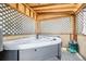Enclosed hot tub with gray exterior and wood interior at 11727 Oswego St, Commerce City, CO 80640