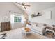 Bright and spacious living room featuring plush carpet, vaulted ceilings, and comfortable seating arrangements at 11727 Oswego St, Commerce City, CO 80640