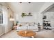 Bright and spacious living room featuring plush carpet, vaulted ceilings, and comfortable seating arrangements at 11727 Oswego St, Commerce City, CO 80640