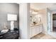 Chic bathroom featuring double sinks, designer lighting, and modern fixtures offers a luxurious experience at 6570 Parterre N Pkwy # 6, Thornton, CO 80602