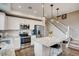 Modern kitchen with white cabinets, granite countertops, stainless steel appliances, and kitchen island at 6570 Parterre N Pkwy # 6, Thornton, CO 80602