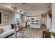 Open floor plan with kitchen, living room, dining area, and hardwood floors at 6570 Parterre N Pkwy # 6, Thornton, CO 80602